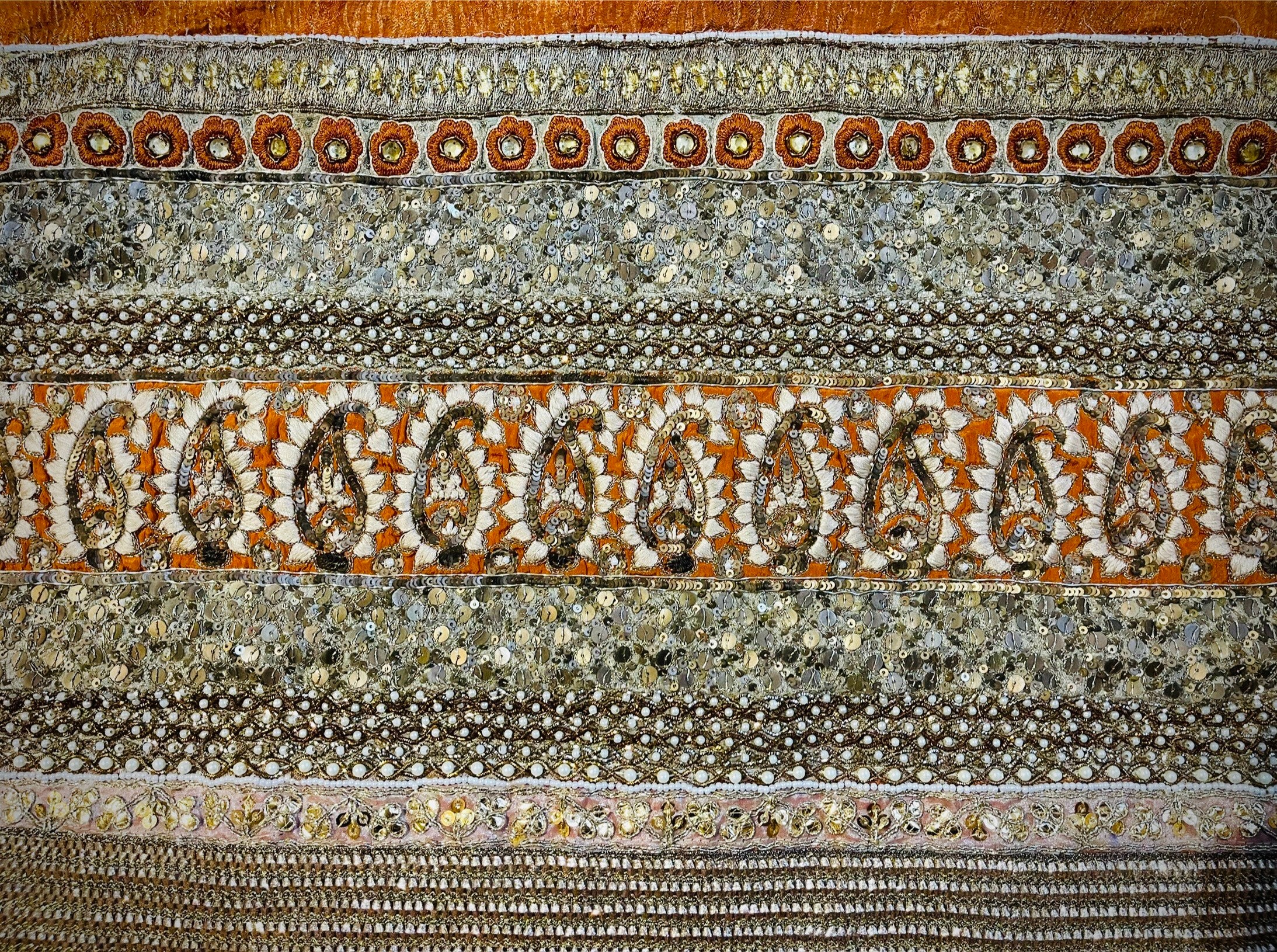 Close-up of a textured fabric with patterned border
